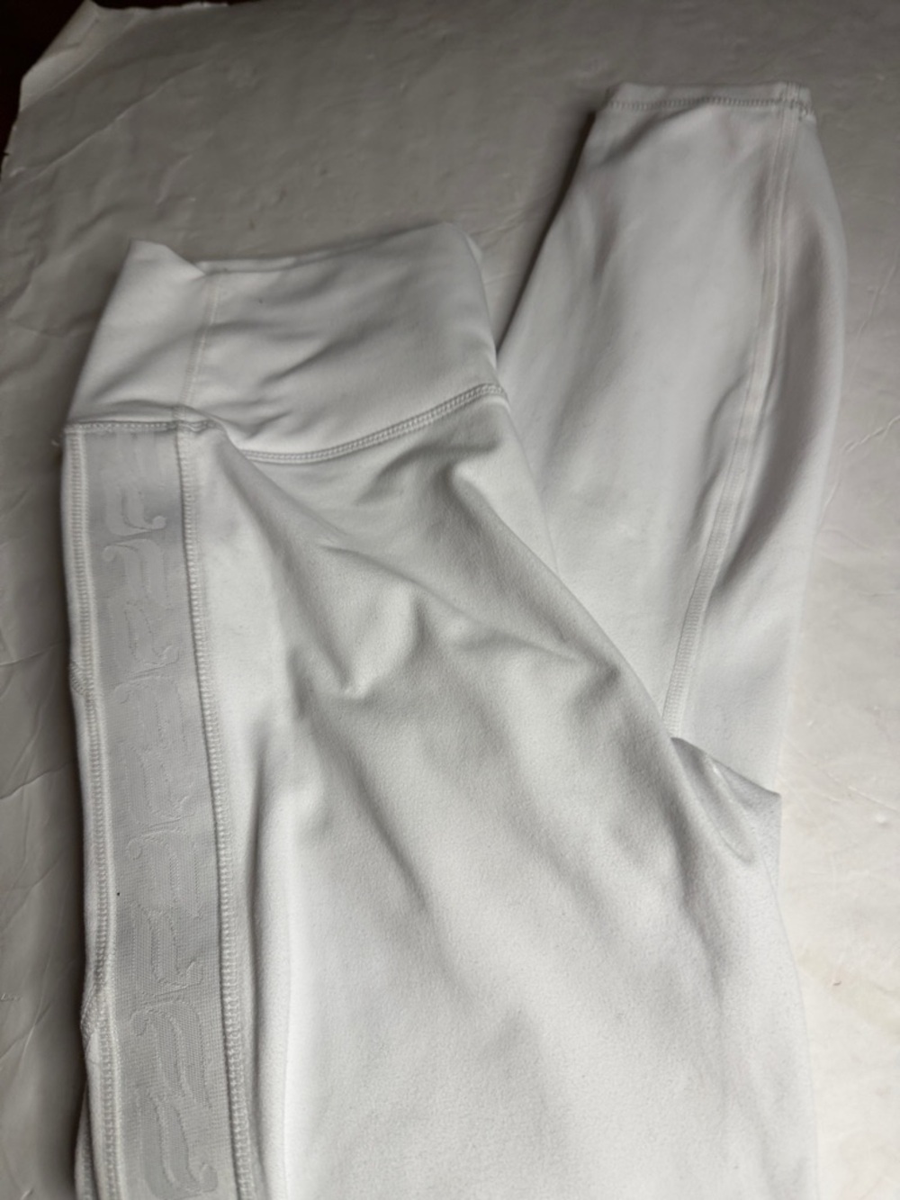 Fabletics power hold White Athletic Leggings with Subtle Jacquard leg Logo